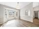 Sunlit dining room featuring bay window and wood-look floors at 610 Woodview Way, Bradenton, FL 34212