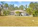 Single-story home with a large yard and attached garage at 610 Woodview Way, Bradenton, FL 34212