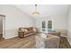Bright Gathering room with pool view and wood-look floors at 610 Woodview Way, Bradenton, FL 34212