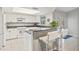 Updated kitchen featuring granite countertops and white cabinetry at 610 Woodview Way, Bradenton, FL 34212