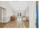 Living room with light flooring, French doors, and comfortable seating at 610 Woodview Way, Bradenton, FL 34212