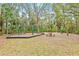 Community playground with swings, play structure, and picnic table at 610 Woodview Way, Bradenton, FL 34212