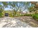 Spacious side yard with mature trees at 610 Woodview Way, Bradenton, FL 34212
