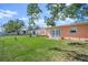 Expansive backyard with two peach-colored houses at 6213 Green View Dr # 127, Sarasota, FL 34231