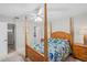 Bedroom with a post bed, walk-in closet and ensuite at 6213 Green View Dr # 127, Sarasota, FL 34231