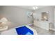 Bedroom with mirrored dresser, blue bedspread, and vinyl wood flooring at 6213 Green View Dr # 127, Sarasota, FL 34231