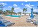 Inviting community pool with lounge chairs and tables at 6213 Green View Dr # 127, Sarasota, FL 34231