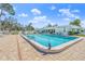 Refreshing community pool surrounded by lounge chairs at 6213 Green View Dr # 127, Sarasota, FL 34231