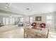 Open concept dining room with view of the living room and kitchen at 6213 Green View Dr # 127, Sarasota, FL 34231