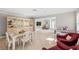 Open concept dining room with views into the living room and kitchen at 6213 Green View Dr # 127, Sarasota, FL 34231
