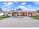 Cute pastel pink exterior with carport and small yard at 6213 Green View Dr # 127, Sarasota, FL 34231