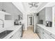 Gray kitchen cabinets, white subway tile, stainless steel appliances at 6213 Green View Dr # 127, Sarasota, FL 34231