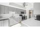 Modern kitchen with gray cabinets, white countertops, and stainless steel appliances at 6213 Green View Dr # 127, Sarasota, FL 34231