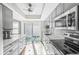 Modern kitchen with gray cabinets, white countertops, and backyard access at 6213 Green View Dr # 127, Sarasota, FL 34231