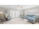 Relaxing living room with light blue sectional sofa and French doors at 6213 Green View Dr # 127, Sarasota, FL 34231