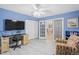 Home office with wood desk, comfy chair, and doors to the dining area at 6213 Green View Dr # 127, Sarasota, FL 34231