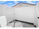 Private patio with two chairs and a white fence at 6213 Green View Dr # 127, Sarasota, FL 34231