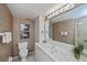Clean bathroom with a toilet and updated vanity at 627 Alhambra Rd # 601, Venice, FL 34285
