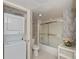 Bathroom with stackable washer/dryer and bathtub at 627 Alhambra Rd # 601, Venice, FL 34285