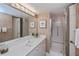 Bathroom with walk-in shower and updated vanity at 627 Alhambra Rd # 601, Venice, FL 34285