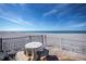 Concrete patio table and chairs with scenic beach view at 627 Alhambra Rd # 601, Venice, FL 34285