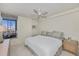 Bedroom with large bed, ocean view, and ceiling fan at 627 Alhambra Rd # 601, Venice, FL 34285