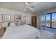Comfortable bedroom with ocean view and wicker furniture at 627 Alhambra Rd # 601, Venice, FL 34285