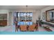 Elegant dining room with chandelier and ocean view at 627 Alhambra Rd # 601, Venice, FL 34285