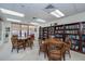 Well-lit condo library with ample bookshelves and seating at 627 Alhambra Rd # 601, Venice, FL 34285