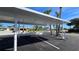 Covered carport parking with designated space at 627 Alhambra Rd # 601, Venice, FL 34285