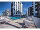 Inviting resort-style pool with lounge chairs and patio tables at 627 Alhambra Rd # 601, Venice, FL 34285