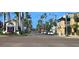 Street view of Venice, Florida, showing shops and palm trees at 627 Alhambra Rd # 601, Venice, FL 34285