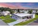Aerial view of a mobile home community with mature landscaping at 6401 Floral Ct, North Port, FL 34287