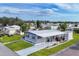 Aerial view of a mobile home with a large covered patio at 6401 Floral Ct, North Port, FL 34287