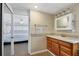Updated bathroom with wood vanity and a shower at 6401 Floral Ct, North Port, FL 34287