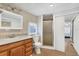 Clean bathroom with a large vanity, shower, and toilet at 6401 Floral Ct, North Port, FL 34287