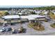 Community center with ample parking and flag at 6401 Floral Ct, North Port, FL 34287