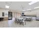 Bright community room with tables and chairs, ideal for gatherings at 6401 Floral Ct, North Port, FL 34287