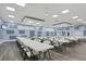 Large community room with many tables and chairs at 6401 Floral Ct, North Port, FL 34287