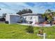 Home exterior, showing a shed and nicely landscaped yard at 6401 Floral Ct, North Port, FL 34287