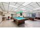 Relaxing game room with two billiard tables and comfortable seating at 6401 Floral Ct, North Port, FL 34287