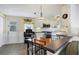 Kitchen with white cabinets, stainless steel appliances, and a breakfast bar at 6401 Floral Ct, North Port, FL 34287