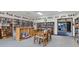 Inviting community library with bookshelves, tables, and chairs at 6401 Floral Ct, North Port, FL 34287