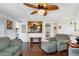 Living room with sofas, ottoman, and built-in shelving at 6401 Floral Ct, North Port, FL 34287