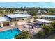 Community pool with surrounding lounge chairs at 6401 Floral Ct, North Port, FL 34287