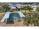 Two covered shuffleboard courts with benches, perfect for outdoor recreation at 6401 Floral Ct, North Port, FL 34287