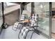 Relaxing balcony with two chairs and game board, offering tranquil views at 647 White Pine Tree Rd # 34, Venice, FL 34285