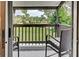 Private balcony with wicker chairs and view of the community at 647 White Pine Tree Rd # 34, Venice, FL 34285