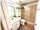 Bathroom with shower, vanity, and updated flooring at 647 White Pine Tree Rd # 34, Venice, FL 34285