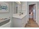 Bathroom features vanity, toilet and access to bedroom at 647 White Pine Tree Rd # 34, Venice, FL 34285